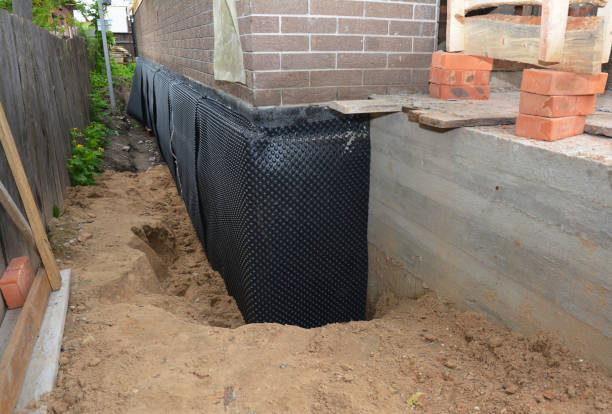 Happy homeowners after waterproofing job in Hart